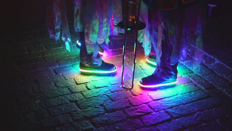 kids wearing flashing colorful shoes, blinking in rainbow color