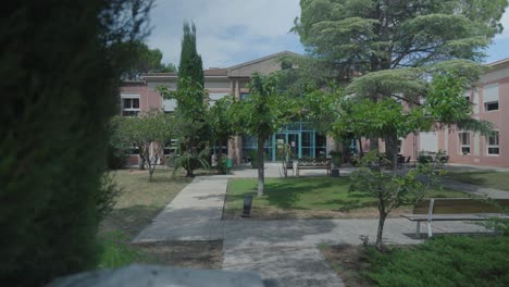 slow revealing shot of the communal garden available at a retirement home in france