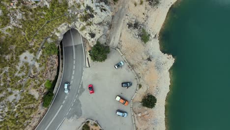 witness beautiful panoramic views of gorg blau and the winding roads in sierra de tramuntana, mallorca. this location features lush landscapes and tranquil waters, perfect for nature lovers.