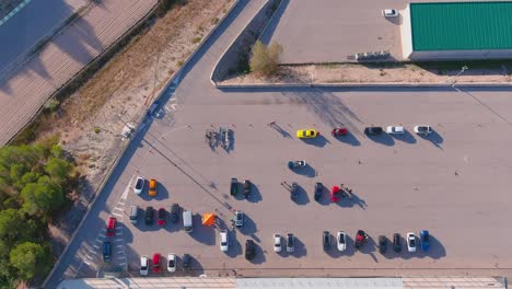 Top-aerial-view-of-cars-parking-at-Circuit-Parcmotor-Castelloli,-Barcelona,-Spain