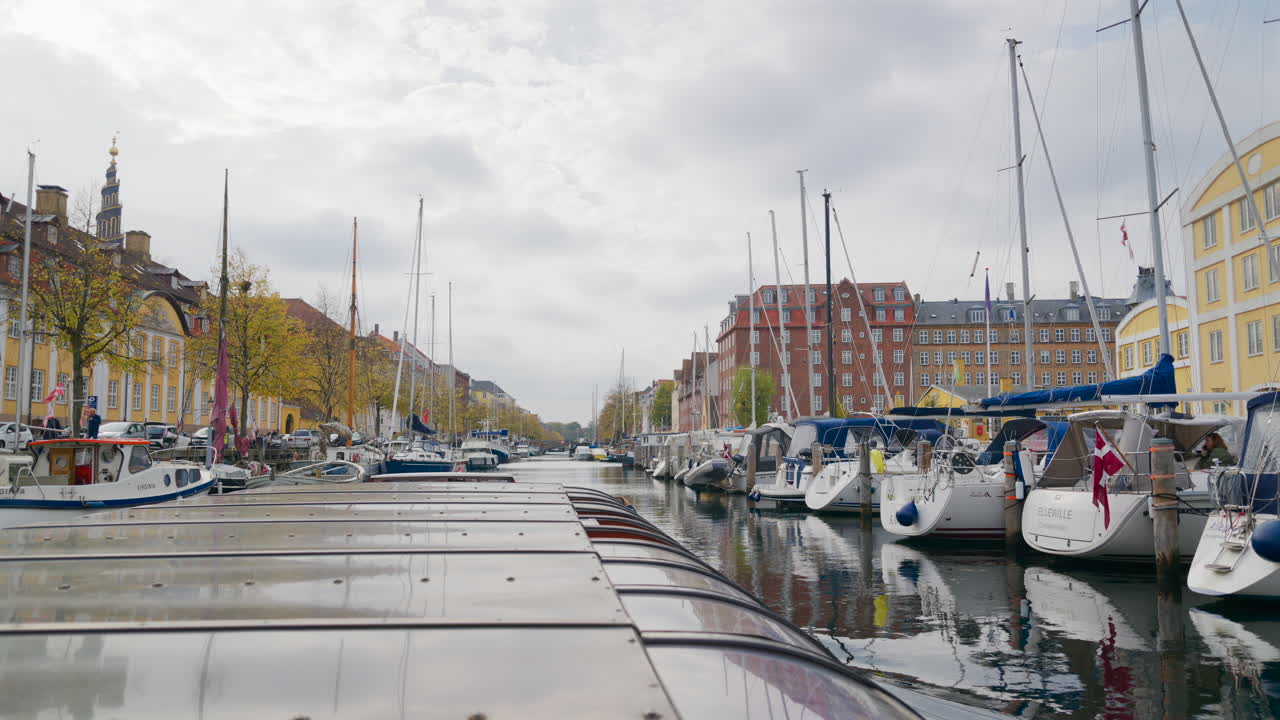Boats docked on the Christianshavn Canal in the Christianshavn neighbourhood of Copenhagen, Denmark