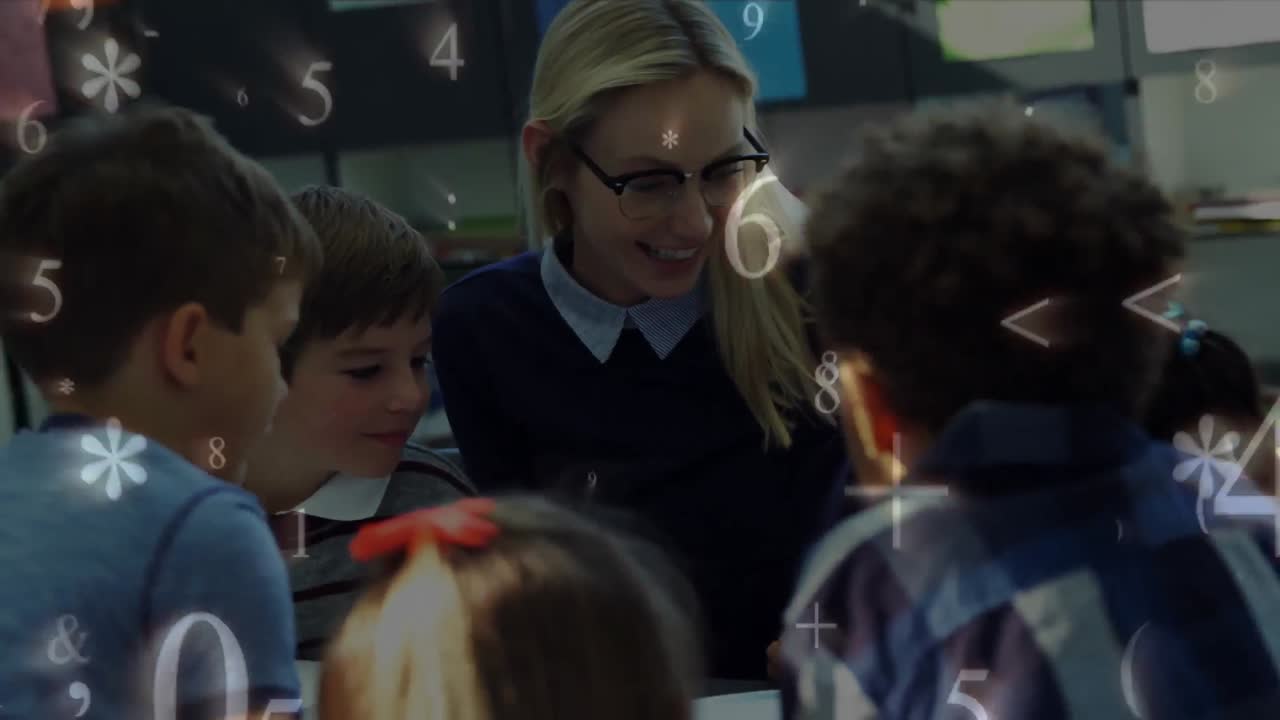 Premium stock video - Schoolchildren study together while numbers and ...