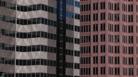 an interesting look at the colors and patterns two highrise buildings and their windows make when shown next to each other