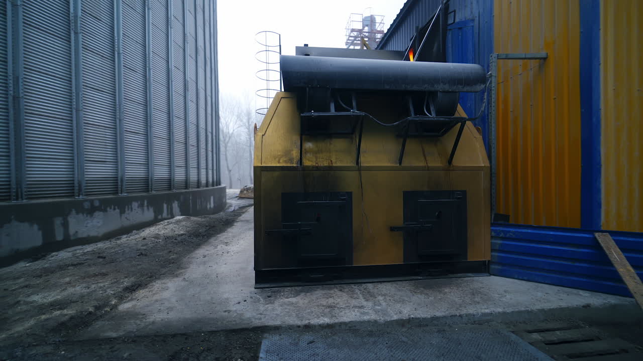 Big factory exterior construction. Huge modern elevator production.