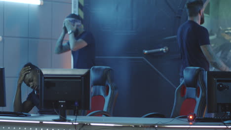 gamer destroying keyboard after losing match medium shot of an angry gamer destroying keyboard after losing a match at a gaming tournament