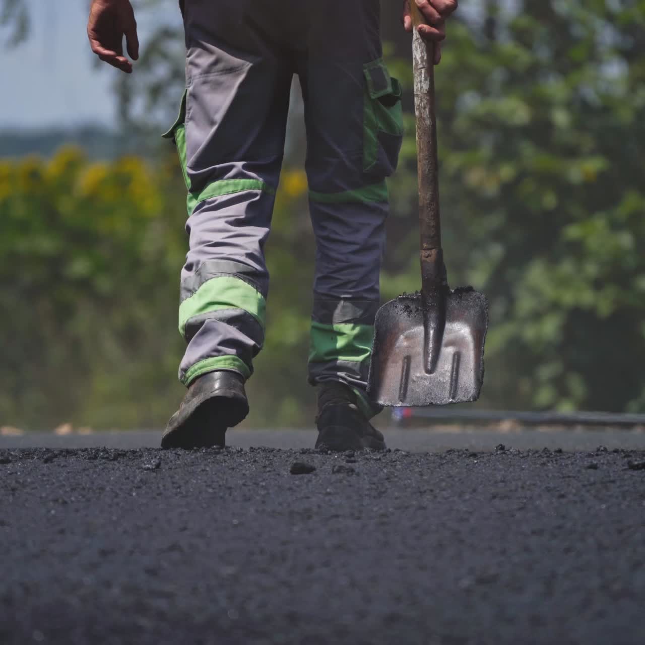 Asphalting of road with steamroller