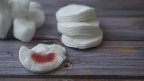 cotton pads on wooden background