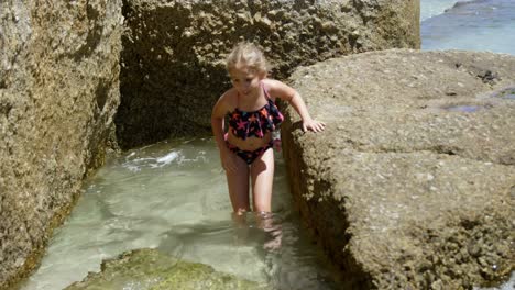 girl walking on water in the beach 4k