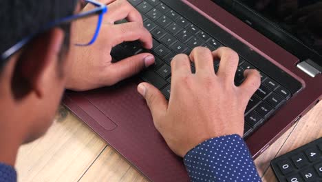 person typing on a laptop