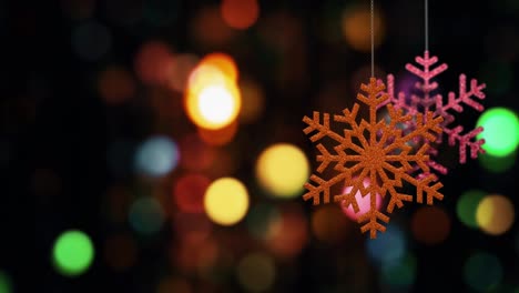 los adornos de copos de nieve de navidad se balancean en el fondo de bokeh archivo de bucle