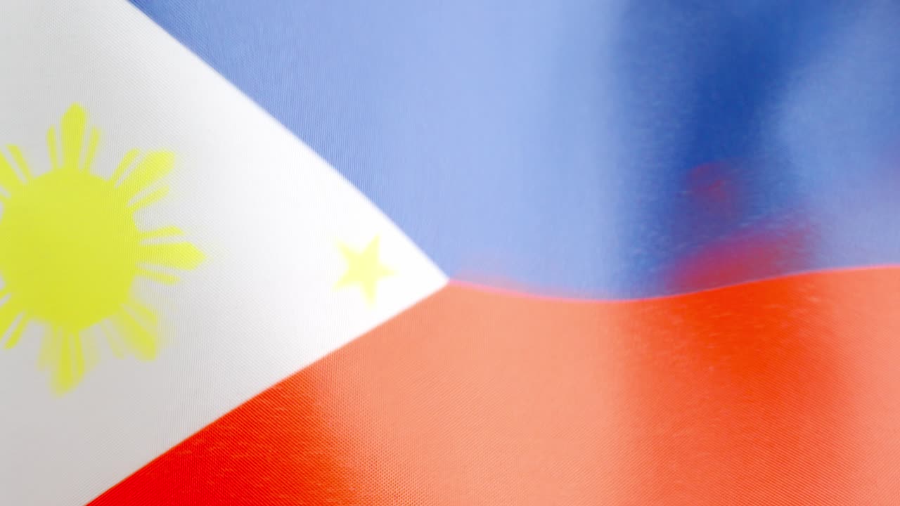 Philippine national flag waving by the wind