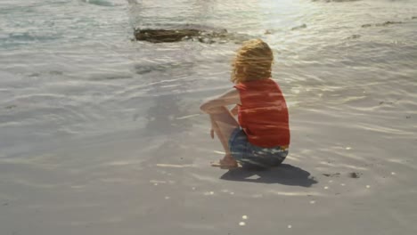 woman sitting on sand