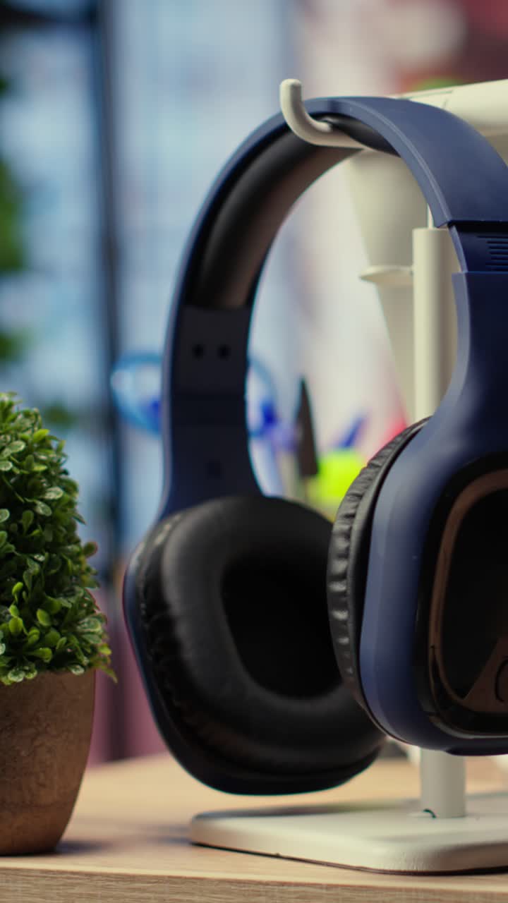 Blue Headphones and Potted Plants on a Modern Office Desk