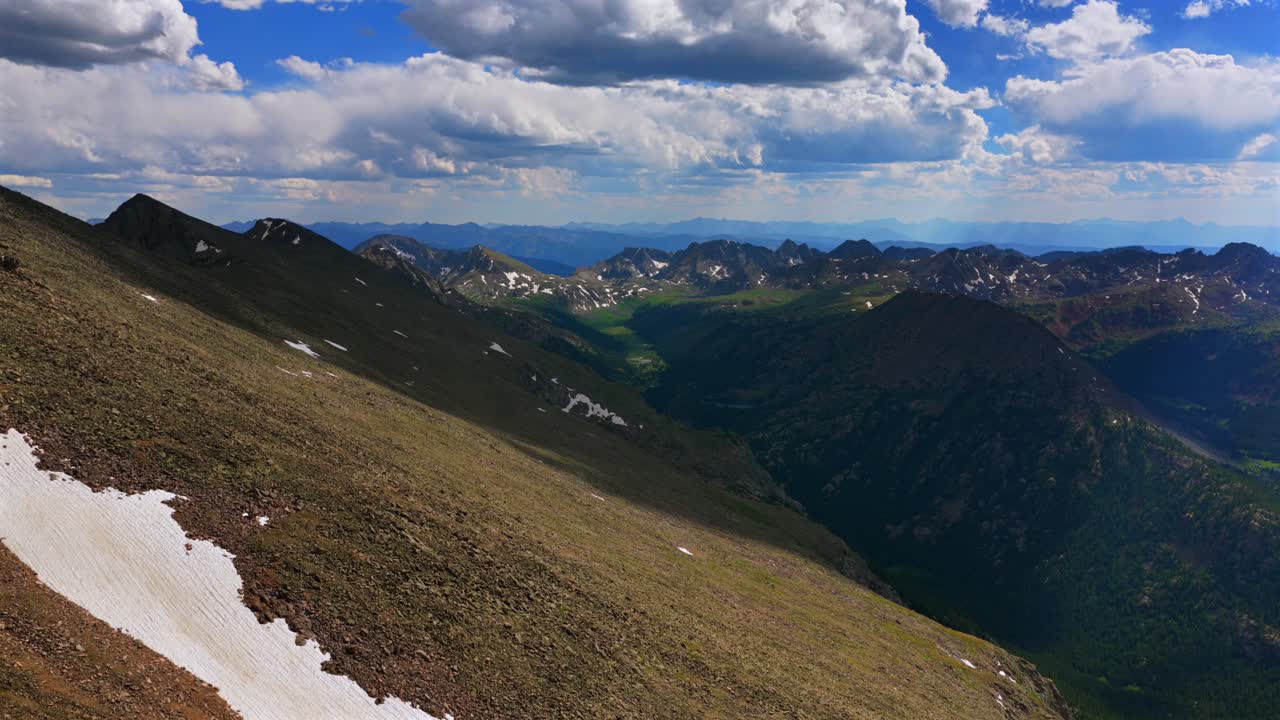 Elk Mountains range Colorado aerial drone spring summer Maroon Bells Capitol Peak Mount Snowmass Castle Conundrum Peak Rocky Mountains Sawatch Range Mount of the Holy Cross 14er snow field forward