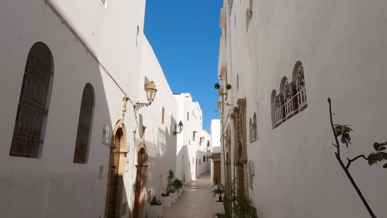 Tranquil alley in Kasbah of the Udayas, Rabat, with serene white architecture