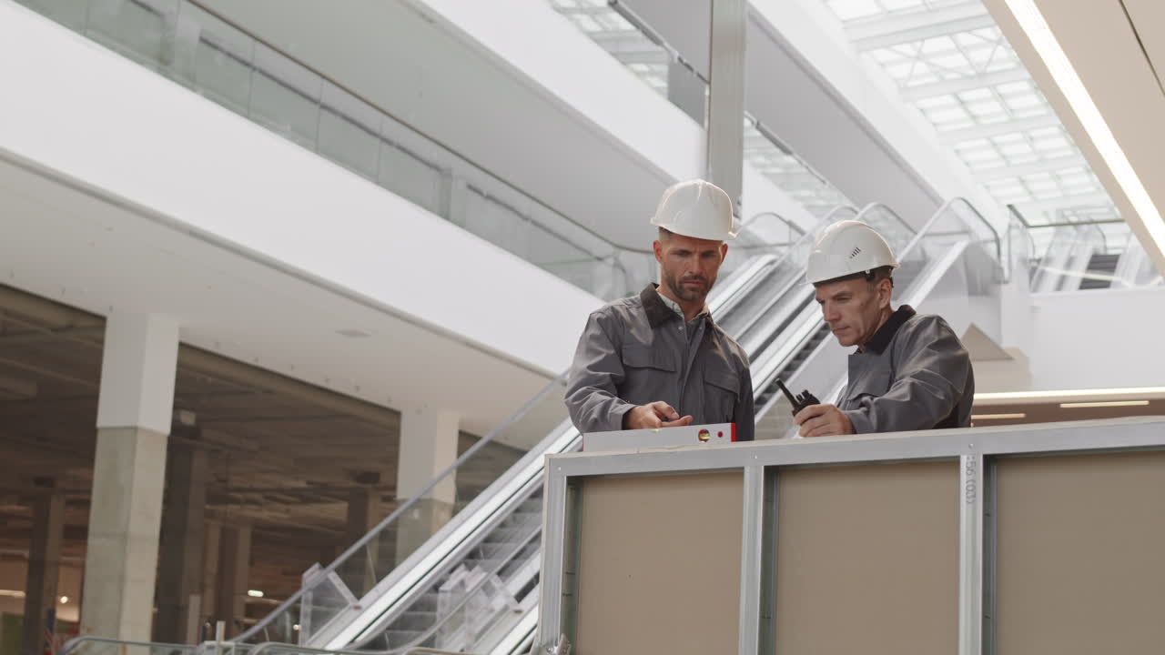 Contractors Looking at Spirit Level