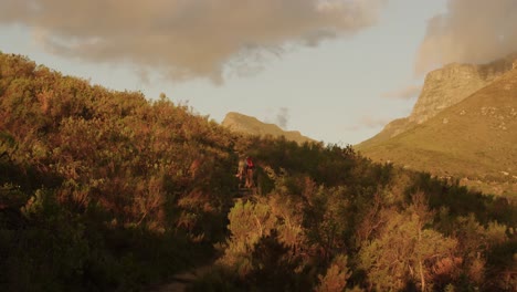 active senior couple hiking in forest