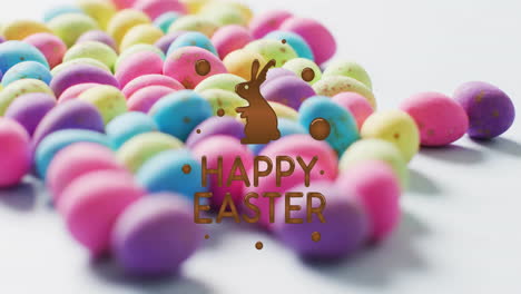 animation of happy easter text over colourful eggs on white background