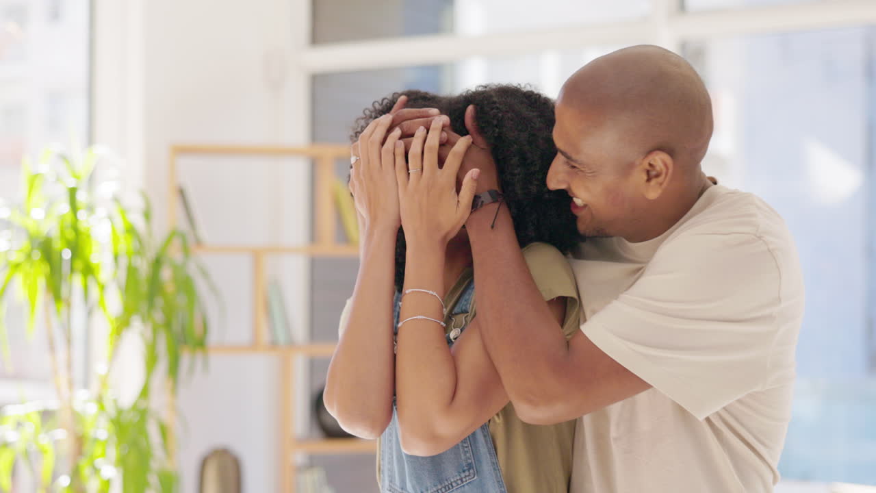 Eyes, cover and surprise with couple in living
