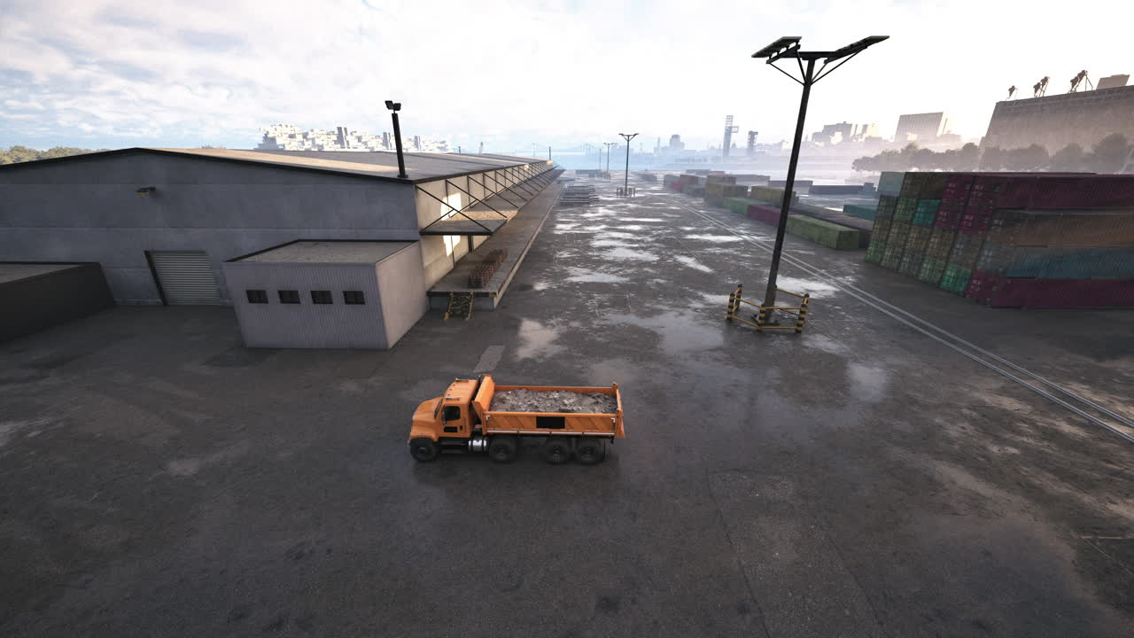 Truck driving down street next to building