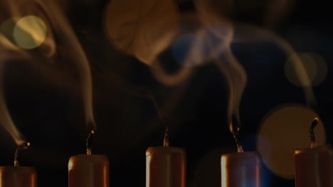 animation of lit candles with flickering spots of light