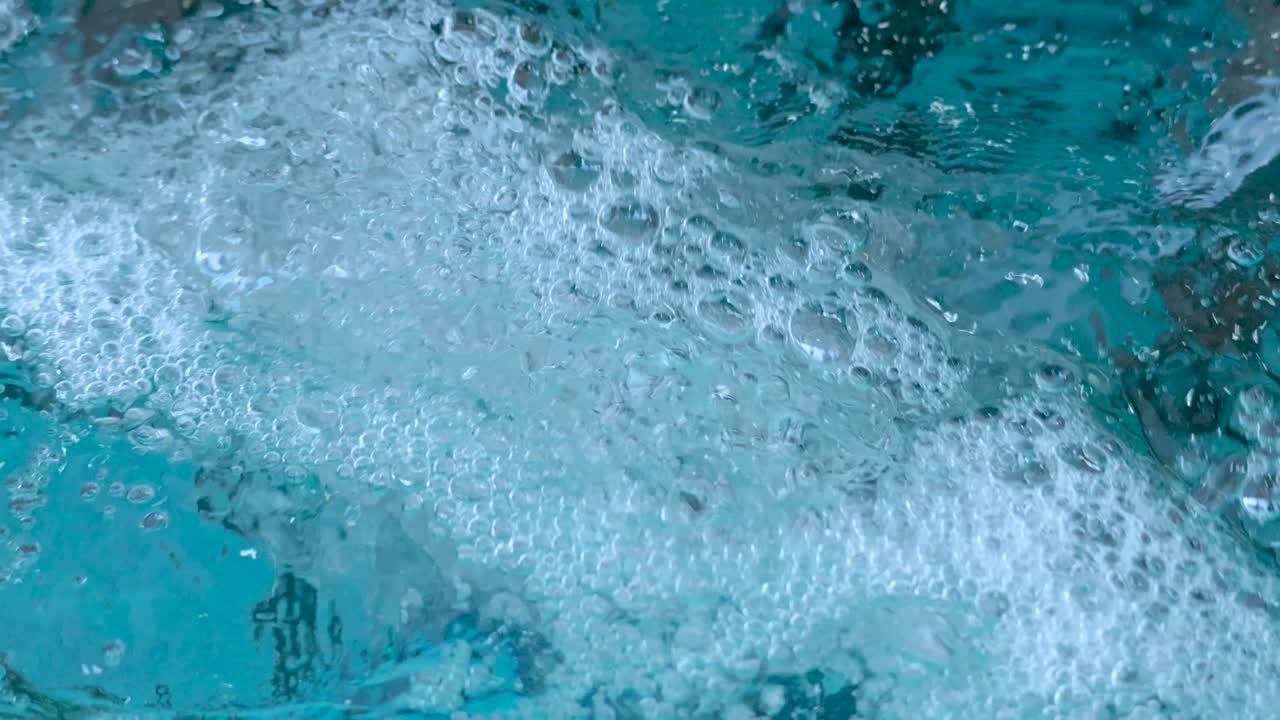 Close-up view of water bubbles and movement