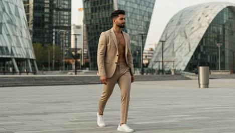 stylish man in tan suit strolling through modern urban landscape with unique architecture and sleek design elements in the background