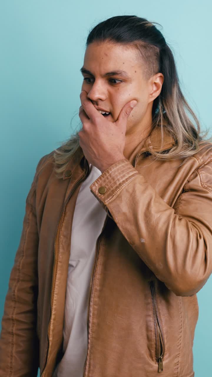Young Man Reacting with Shock and Surprise