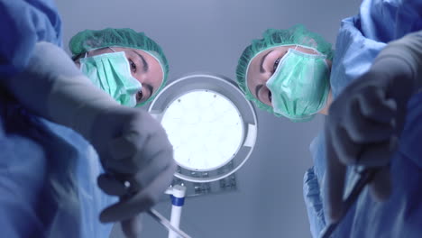 women performing surgery in hospital together