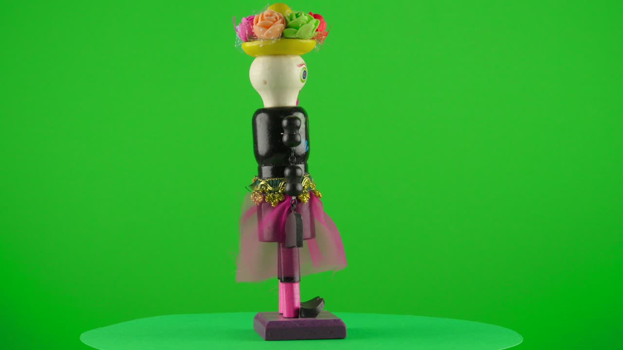 Catrina wooden doll dia de muertos Mexico Skeleton in a turntable with green screen for background removal  latin celebration day of the death