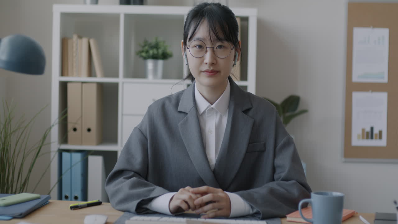Woman giving a video presentation in an office setting