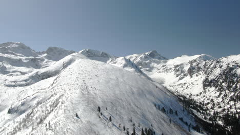 drone shot of snowy peak and ski slope in malyovitsa in bulgaria