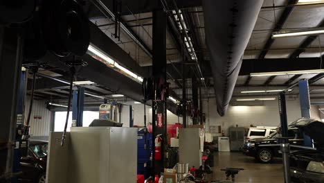 car repair garage air ducts, panning shot