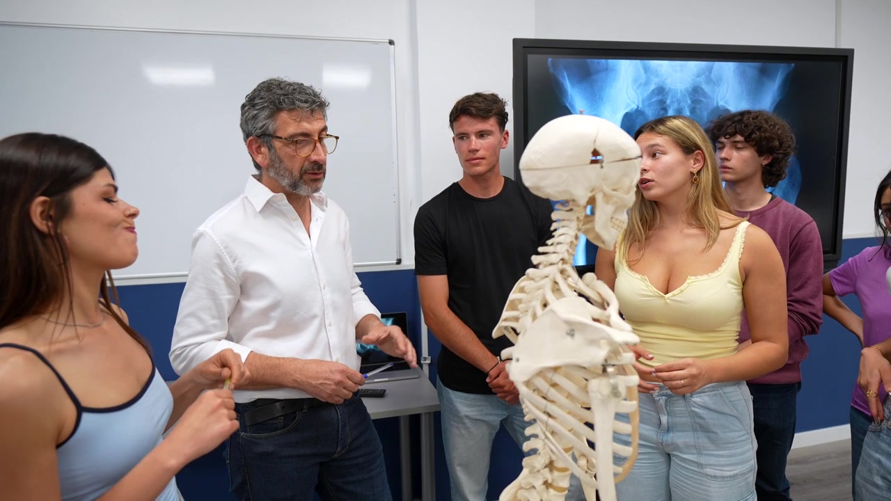 Professor Explaining Human Anatomy to Diverse Students with Skeleton Model