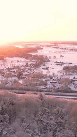 winter sunrise over a snowy village