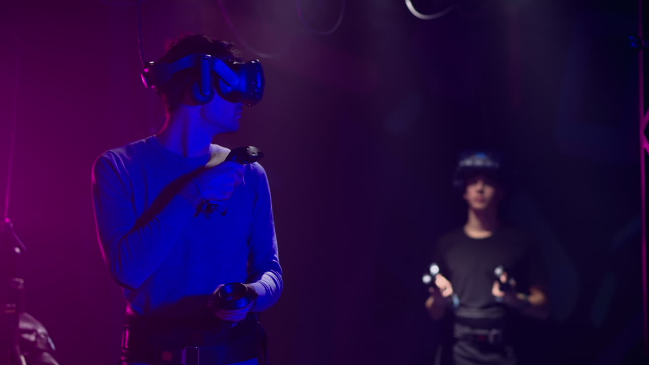 Teenagers playing with a Virtual Reality headset in a studio