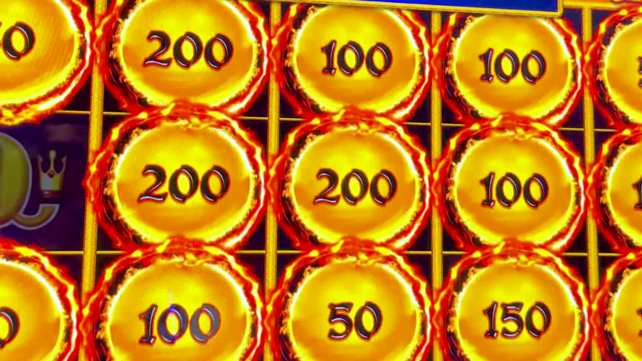 Close-up of slot machine showing coin values and free spins completion message.