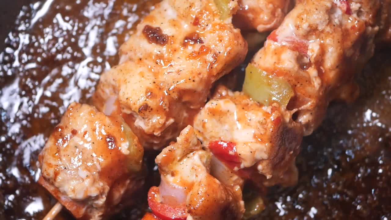 Chicken skewers cooking
