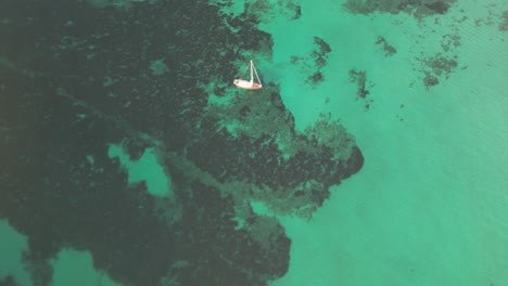 Sailboat-On-Turquoise-Sea-Near-Sa-Coma-In-Mallorca-Island-Of-Spain