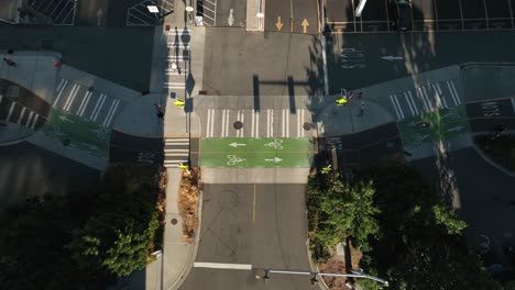 drone shot of a pedestrian heavy intersection early in the morning in seattle's business district