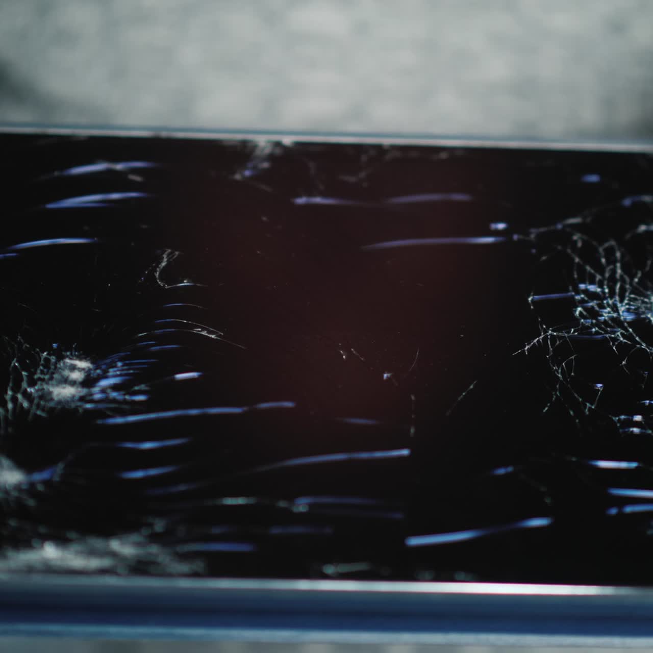 A Man Holds A Tablet With A Broken Screen 1
