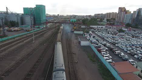 aerial drone station close up following train in mongolia ulan bator. sunny day