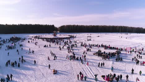 large crowd gathering at a winter ice festival