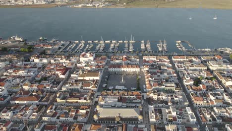 vila real de santo antonio cityscape with praça marquês de pombal, main public square and marina with moored boats