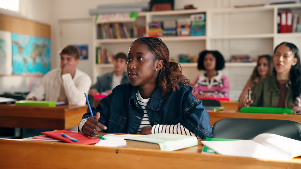 Students Raising Hands in Classroom