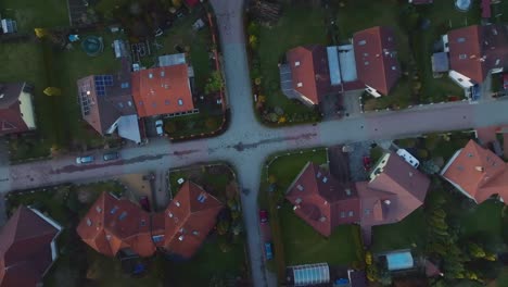 aerial view of street intersection between family houses