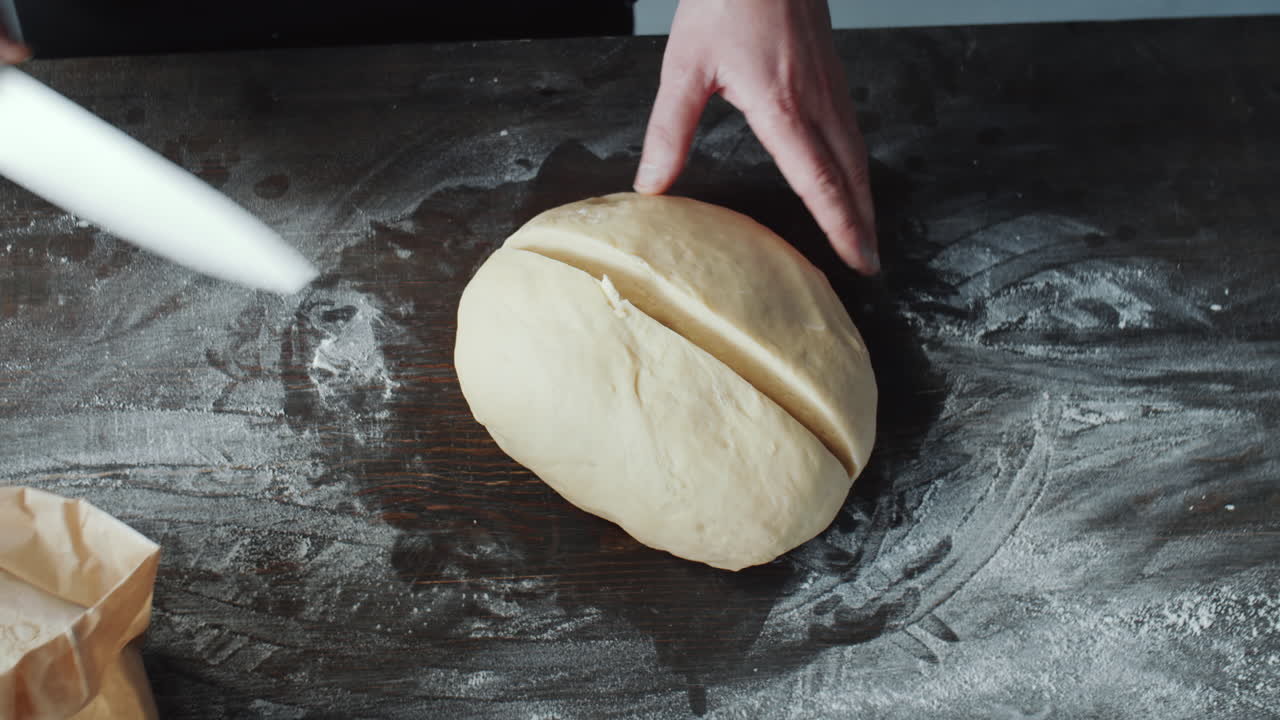 Chef Cutting Dough and Showing Its Cross Section