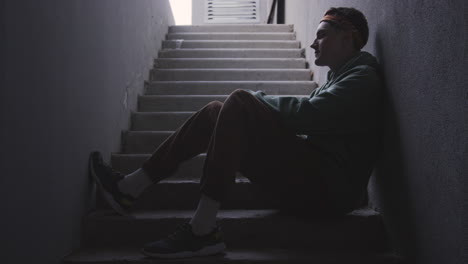 young man sitting on stairs