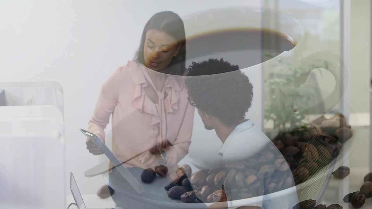 Woman presenting document with colleague in business office, showing coffee cup overlay with beans