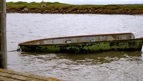 boat floats and moves on the waves, it is moored to the dock